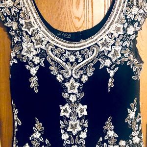 Women’s size medium sequenced Party Top.